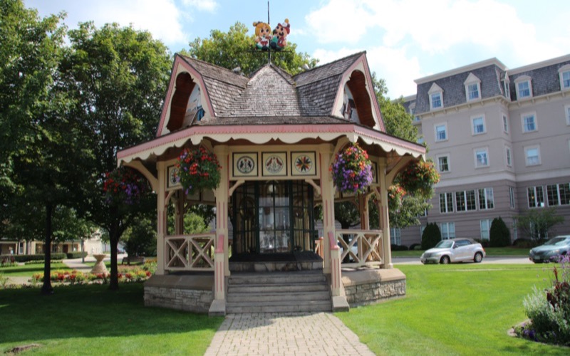 Ornate gazebo with hanging flower baskets in Victoria Park, Kitchener